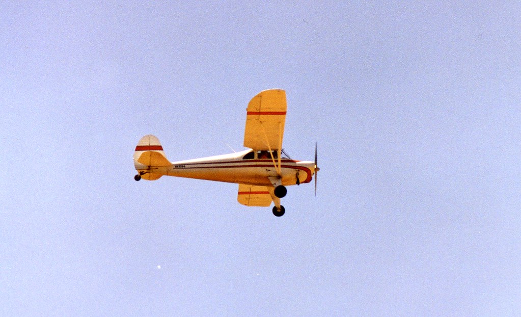 A light aircraft crabbing into wind on a crosswind approach to landing